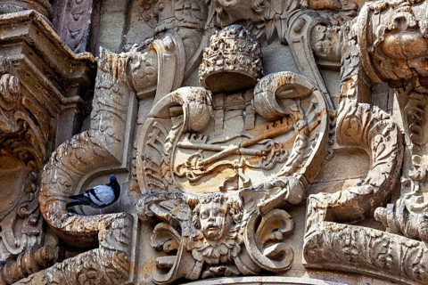 Highly detailed stone façade with a dove, reliefs on the Basilica of St. Francis in Lima in Peru