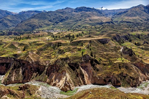 Mountain landscape with many terraces and a river under clear sky, The landscape of the Colca