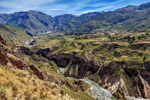 Valley with terraced fields surrounded by mountains and a river, The landscape of the Colca Canyon
