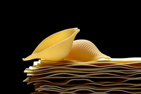 Uncooked lasagna leaves and mussel noodles, conchiglione