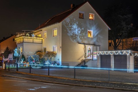 Illuminated Christmas decoration in the garden of a residential building, Nuremberg, Bavaria,
