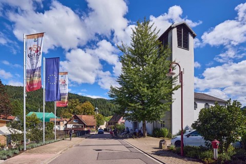 St. Peter and Paul parish church, church tower, flag on flagpole, European flag, 750 years Gutach