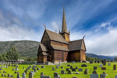 Lom Stave Church (Lom stavkyrkje) with cemetery in the foreground, Lom, Norway