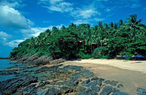 Umbrellas, palm beach at The Narima Resort on the island of Ko Lanta, Thailand, December 2002,