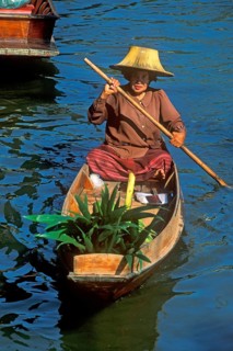 Merchant in her boat at Damnoen Saduak Floating Market, Thailand, December 2002, vintage, retro,