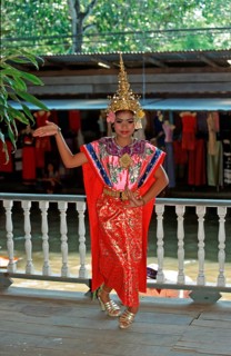 Young person wearing Thai drama clothes at Damnoen Saduak Floating Market, Thailand, December 2002,