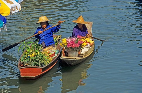 Merchants in their boats at Damnoen Saduak Floating Market, Thailand, December 2002, vintage,