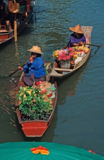 Merchants in their boats at Damnoen Saduak Floating Market, Thailand, December 2002, vintage,