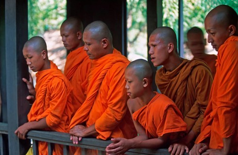 Monks watch performance, Samphran Elephant Ground and Zoo near Bangkok, Thailand, December 2002,