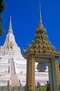 People, chedi, archway, white and gold temple Wat Phukao Thong, Ayutthaya, Thailand, December 2002,