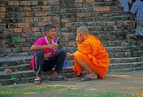 Monk talking on cell phone, teenager, Wat Phra Si Sanphet, Ayutthaya, Thailand, December 2002,