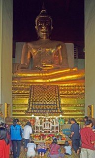 People praying in the temple with the Buddha statue Phra Mongkhonbophit, Ayutthaya, Thailand,