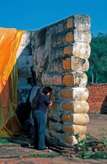 Woman praying, statue of reclining Buddha, feet, Ayutthaya, Thailand, December 2002, vintage,