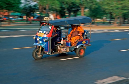 Monk in a three-wheeled tuk tuk taxi, blurred, Bangkok, Thailand, December 2002, vintage, retro,