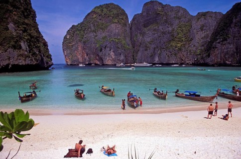 People, longtail boats on Maya Bay beach, known from the movie The Beach, one year in front of the