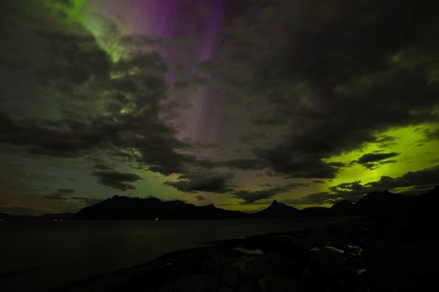 The Vestfjord in Nordland, Norway, has an enchanting atmosphere at night. Dark clouds and vivid