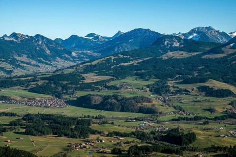 View from the Bolsterlanger Horn of villages in the Illertal and mountains of the Allgäu Alps,