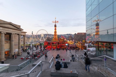 Stuttgart 2025 Christmas market on Schlossplatz with festive lights, a Christmas pyramid, mulled