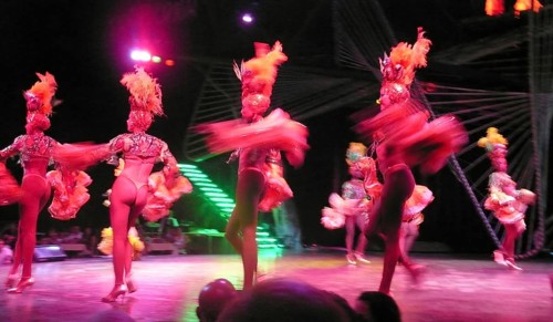 Revue dancers in opulent colorful costume and with feather headdress at Club Tropicana, Havana,