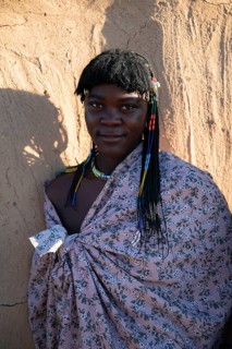 Portrait, brightly decorated woman of the Hakaona tribe, also Havakona or Hakawona, near Opuwo,