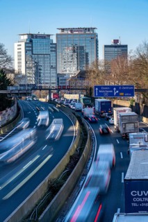 The A40 motorway, Ruhrschnellweg, in Essen, city skyline, Evonik office building, traffic jam in