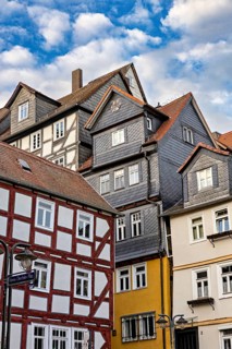 Historic half-timbered houses under a slightly cloudy sky, The historic city center of Marburg in