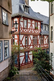 Idyllic half-timbered houses in a narrow alley with a nostalgic atmosphere, The historic old town