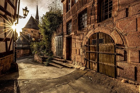 Historic alley with old charm and sunshine through the old town, The historic alleys and streets of