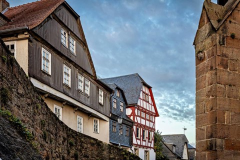 Half-timbered houses and city walls in a cozy evening mood, The historic city center of Marburg in
