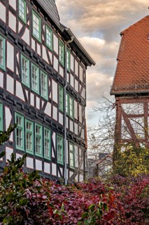 Historic half-timbered houses with red tiled roofs in autumn, The historic city center of Marburg