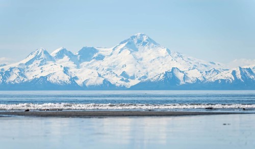 Beach at Anchor Point, Cook Inlet, glaciated mountain peaks of the Aleutian Range with Mount