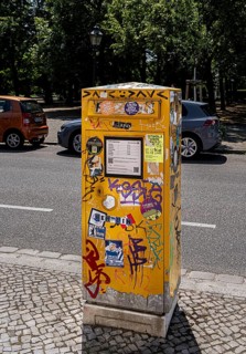 Deutsche Post letterbox with stickers and graffiti, Potsdam, Brandenburg, Germany