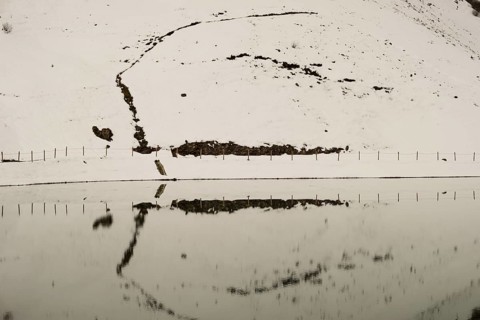 Another onset of winter in May, Riezler Alpsee, an artificially created lake, snow pond, feeds the