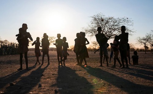 Himba children playing, evening mood, traditional Himba village, Kaokoveld, Kunene, Namibia