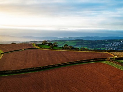 Colours of autumn Fields and Farms over Sheldon from a drone, Torbay, Devon, England, United