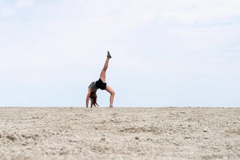 Abstract, woman doing gymnastics in a whirring landscape, Etosha pan, Etosha National Park, Namibia
