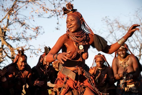 Himba woman dancing euphorically, traditional dance, traditional Himba village, Kaokoveld, Kunene,