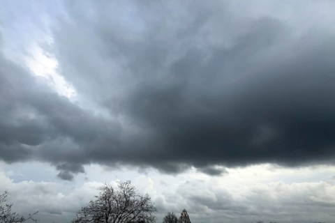 Large grey cloud roller Stratocumulus cluster layer cloud during high winter conditions,