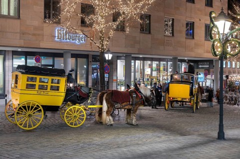 Historic stagecoach rides with horseback during the Nuremberg Christmas Market, Nuremberg, Middle