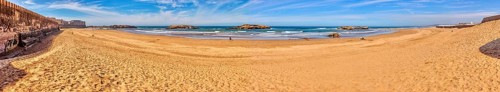 Extensive sandy beach with calm sea and clear sky, Morocco, Essaouira, coast, panorama