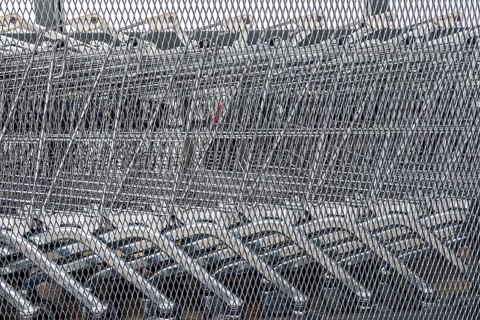 Close-up of several unused shopping carts, economic crisis, consumption