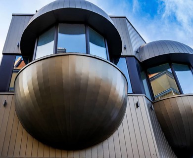 Futuristic balconies with bay windows on a prefabricated building from the sixties in