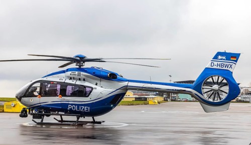 Helicopter from the Baden-Württemberg Police team in front of the hangar at the airport. Airbus