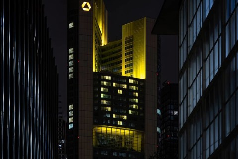 A yellow heart glows on the façade of the Commerzbank Tower in Frankfurt am Main at Christmas time