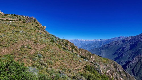 Landscape with a wide view of a mountainous landscape under clear, blue sky, The mountains and