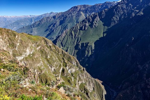 Extensive mountain landscape with deep gorge and sparse vegetation, The mountains and valleys of