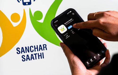 In this photo illustration, a person downloads the Sanchar Saathi mobile application on an iPhone,
