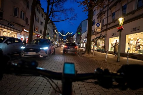 Cycling in the city, in the dark, in the evening, inner-city road, bicycle road, two-wheeler