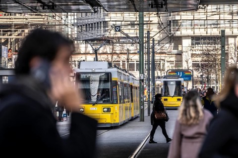 Trams at Alexanderplatz in Berlin, passers-by, Germany