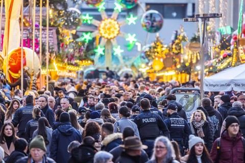 Busy shopping street in Stuttgart. Police patrol in the midst of the crowds. On the first weekend